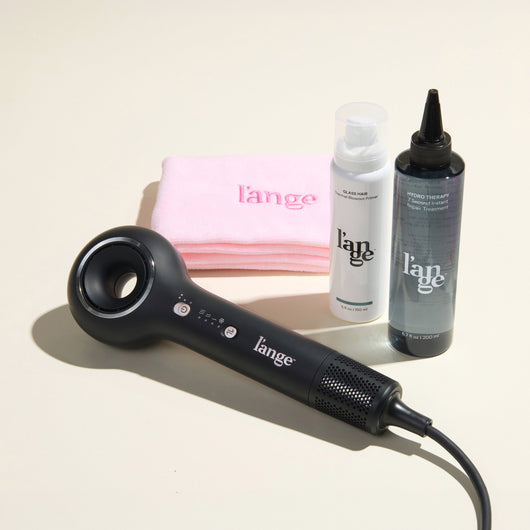 Mane Event Value Set, featuring a Black Axia, a Blush hair wrap towel, Hydro Therapy, and Glass Hair, displayed on a beige background