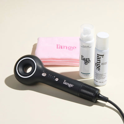 Mane Event Value Set, featuring a Black  Axia, a Blush hair wrap towel, Glass Hair, and Top Coat, displayed on a beige background
