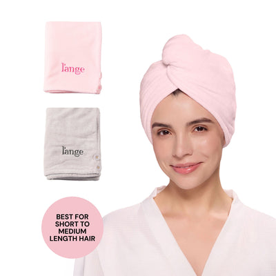 Model wearing a pink L’ange hair wrap towel; folded pink and gray towels shown; badge reads “BEST FOR SHORT TO MEDIUM LENGTH HAIR.”