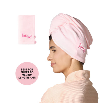 Model wearing a pink L’ange hair wrap towel; folded pink towel shown; badge reads “BEST FOR SHORT TO MEDIUM LENGTH HAIR.”