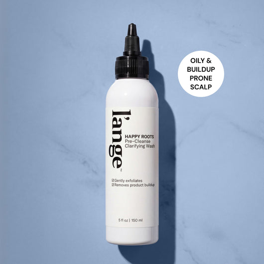 L'ange Happy Roots Pre-Cleanse Clarifying Wash bottle with "Oily & Buildup Prone Scalp" badge on blue background