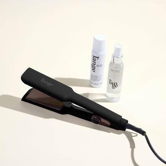 The Sleek Era Value Set, featuring a black 1.75in Le Titane , top coat, and thermal magique, displayed on a beige background
