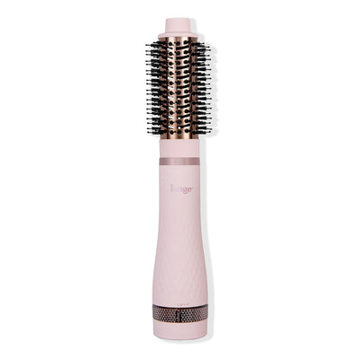 Multi Volume Series 43mm round brush blow dryer in blush pink with rose gold barrel and black bristles.