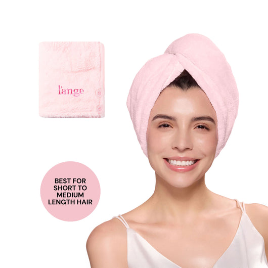 Model wearing a pink L’ange hair wrap towel; folded pink towel shown; badge reads “BEST FOR SHORT TO MEDIUM LENGTH HAIR.”