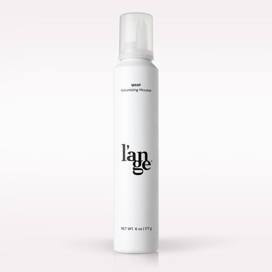L’ange Whip Volumizing Mousse on a blank background